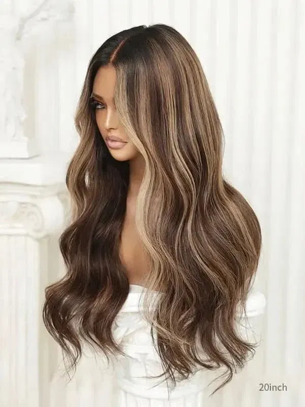 Model wearing a loose-wave wig with warm blonde highlights